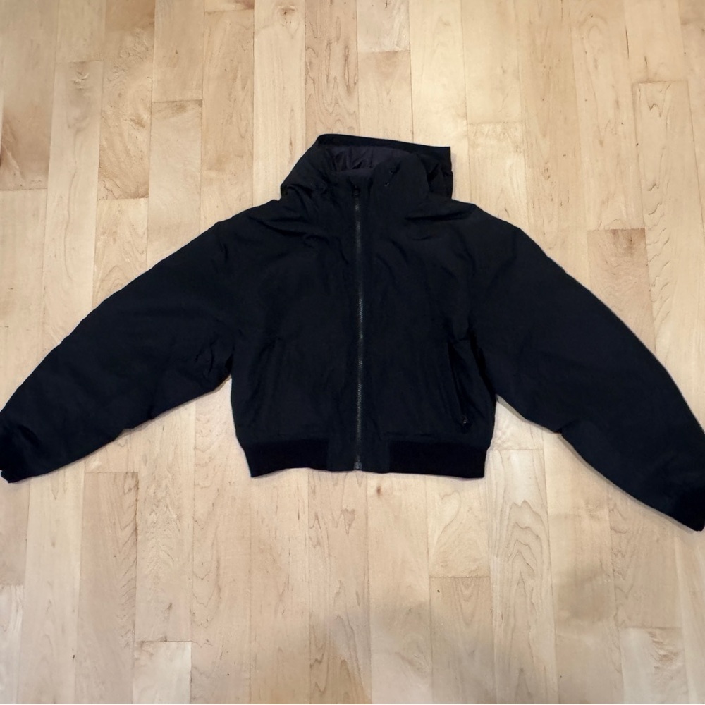 Athleta Black Puffer Jacket (model name is Lucent Jacket).